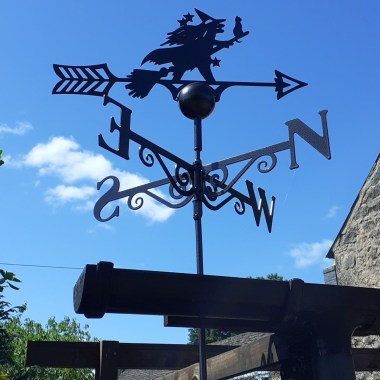 Witch weathervane installed